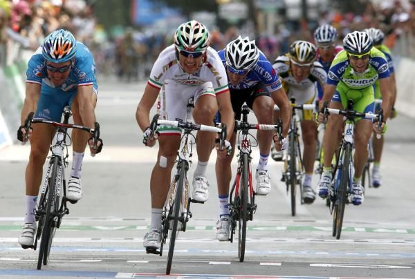 Voeckler lunges for the line, but Pozzato takes the win