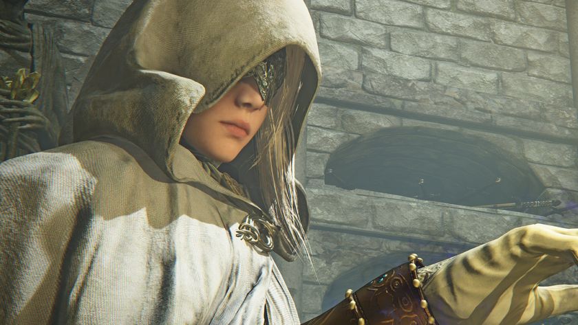 A cloaked Elden Ring Nightreign character lifts her hand and seemingly looks at it despite wearing a mask