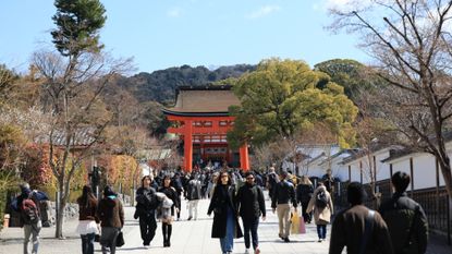 Tourists visit the Fushimi Inari Shrine in Kyoto, Japan, on March 9, 2025.