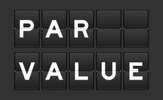 Black color analog flip board with word par value on gray background
