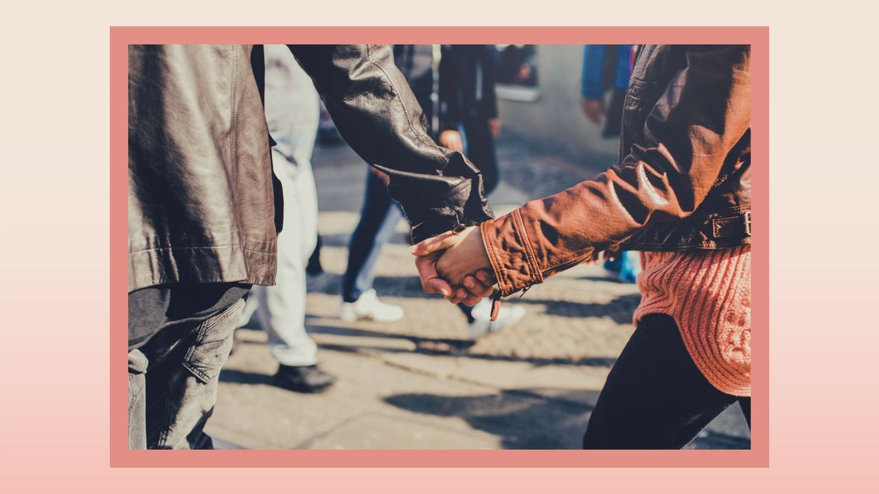 the lower half of a couple&#039;s body walking outside in the fall where the man is ahead of the woman