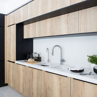 wood neutral black galley kitchen
