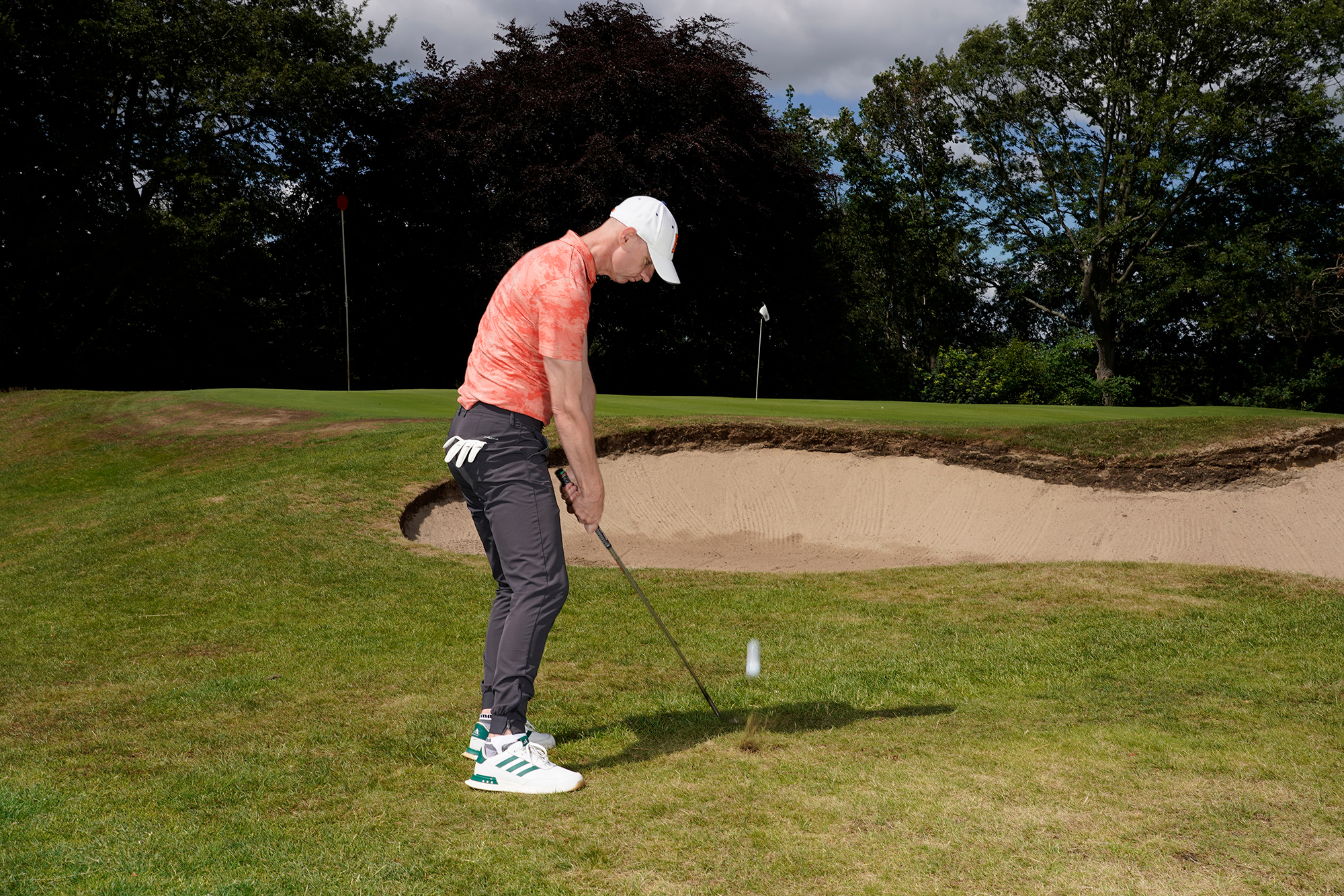 Ged Walters hitting a high-flighted chip shot off the side of the 13th green at Sand Moor Golf Club
