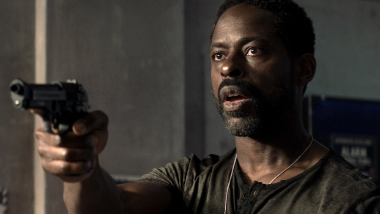 Sterling K. Brown holding a gun in Paradise.