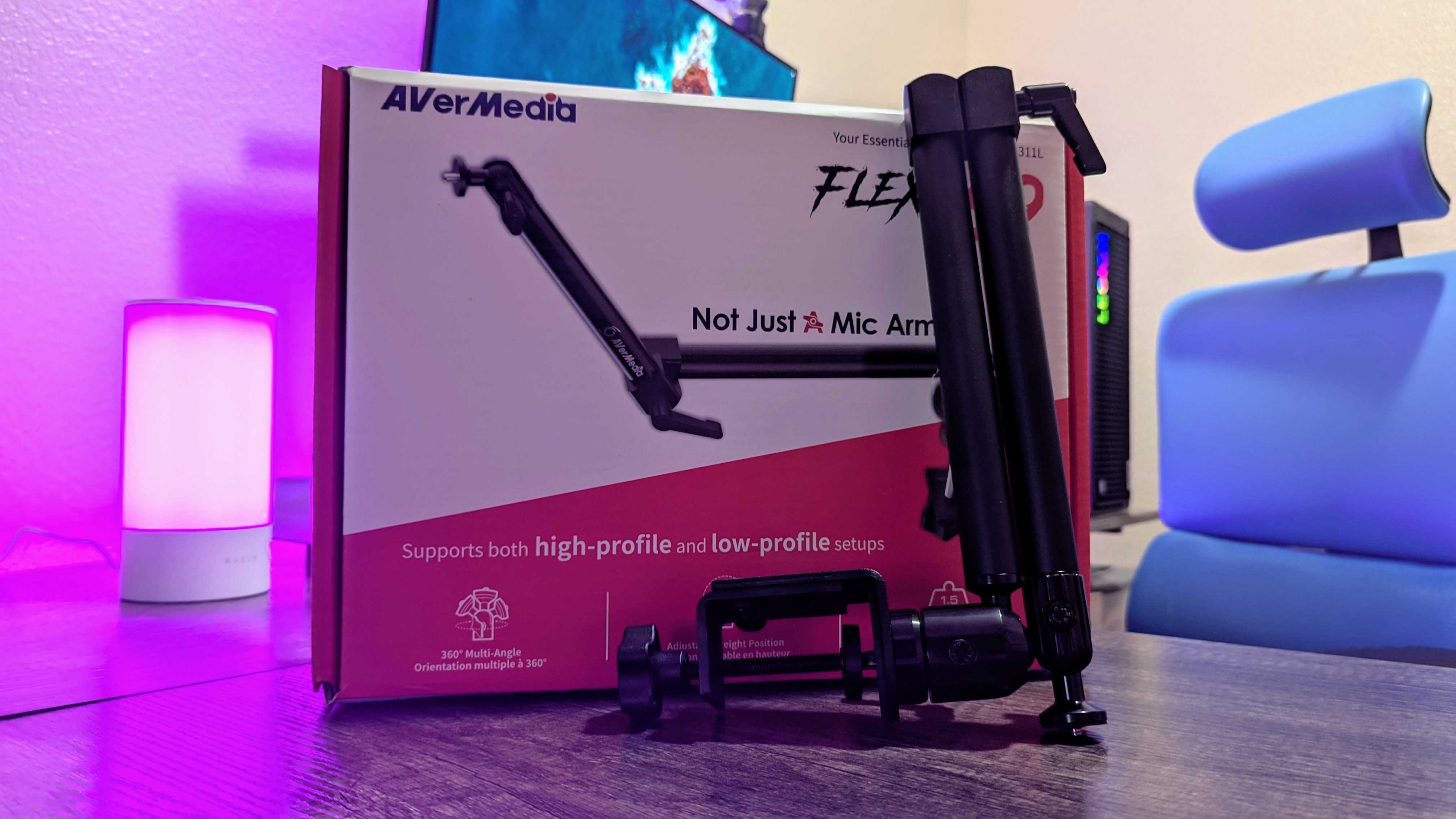 The AVerMedia FLEXI go (BA311L) mic arm, disassembled in front of its packaging.