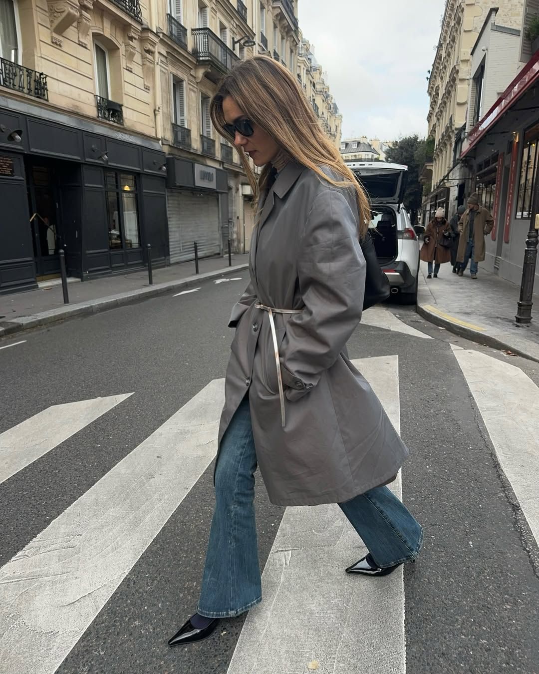 Influencer Annelauremais wearing a belted coat.