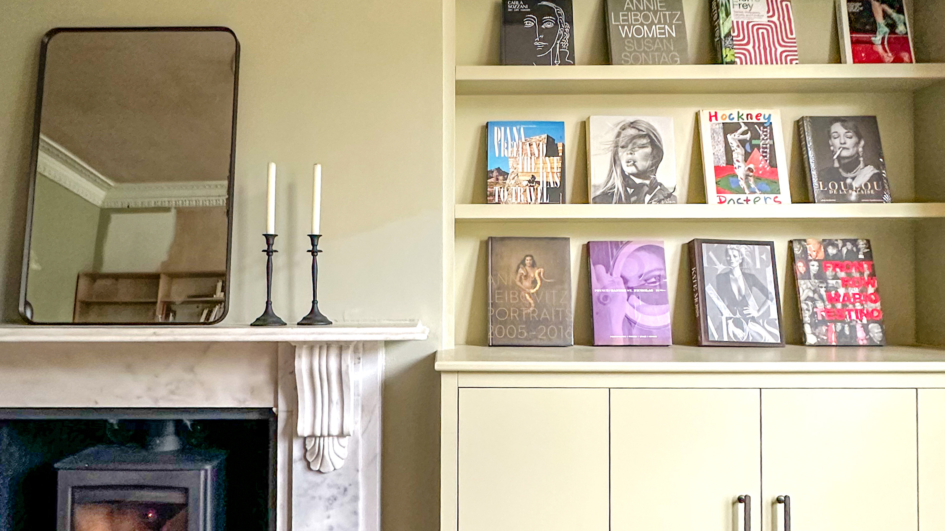 living room with fireplace and bookshelves