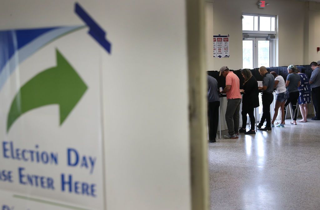  Voters fill out their ballots.