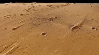 n the distant past, large volumes of water must have rushed through the Ares Vallis on Mars. Streamlined islands have been eroded on the valley floor, indicating the direction taken by the water.