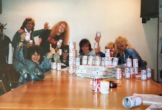 Shy at a record company boardroom desk surrounded by beer cans, with Classic Rock's Dave Ling
