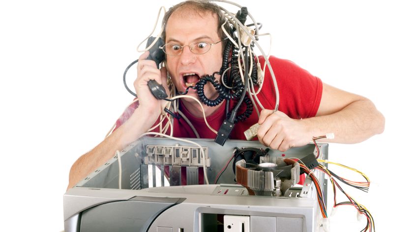 man in panic with his computer trying to reach hotline
