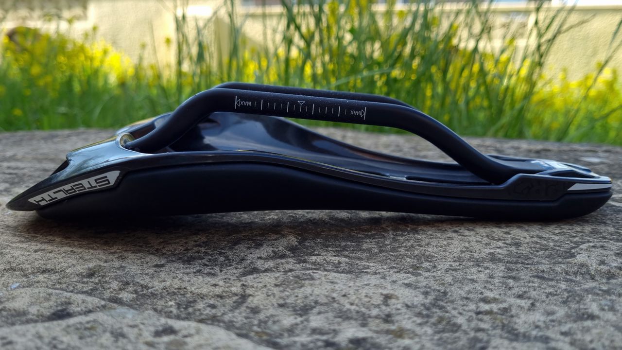 A close up of the Pro Stealth Carbon Saddle on a stone floor