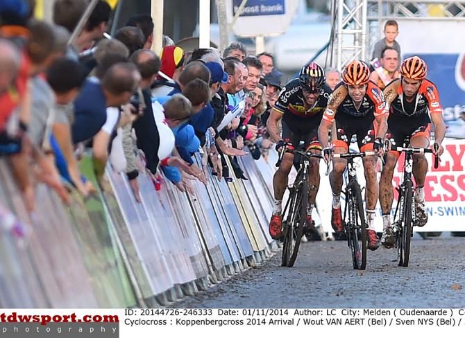Wout Van Aert (Vastgoedservice - Golden Palace Cycling Team) and Sven Nys (Crelan-AA Drink Team) are forced to maneuver around Van Aert's lapped teammate in the final sprint