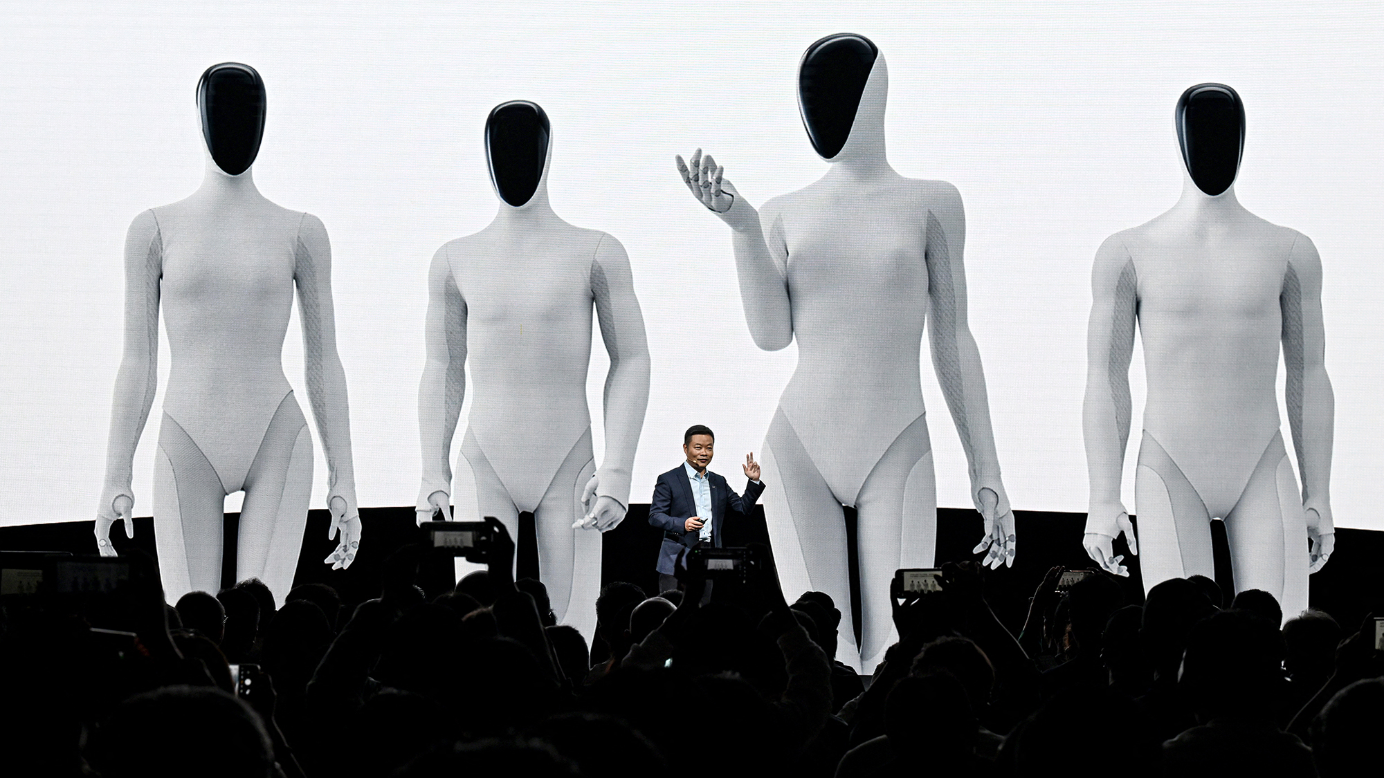 Xpeng chairman He Xiaopeng announces the company&#039;s new IRON robot during a press conference in Guangzhou, China