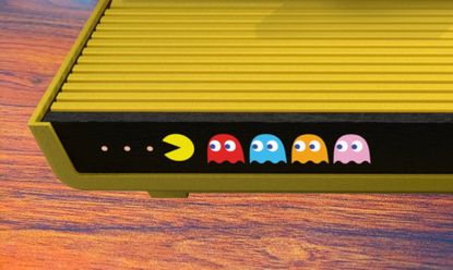 Close up of Atari 2600+ Pac-Man edition with view of yellow console and characters on front featuring Pac-Man and four ghosts.