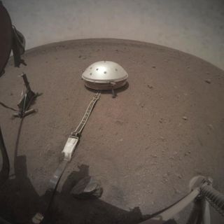The view from InSight's Instrument Context Camera under the lander's deck when Mars' moon Phobos passed in front of the sun on March 6, 2019, causing a 26.7 second eclipse. (This camera also captures a frame of video every 50 seconds.)