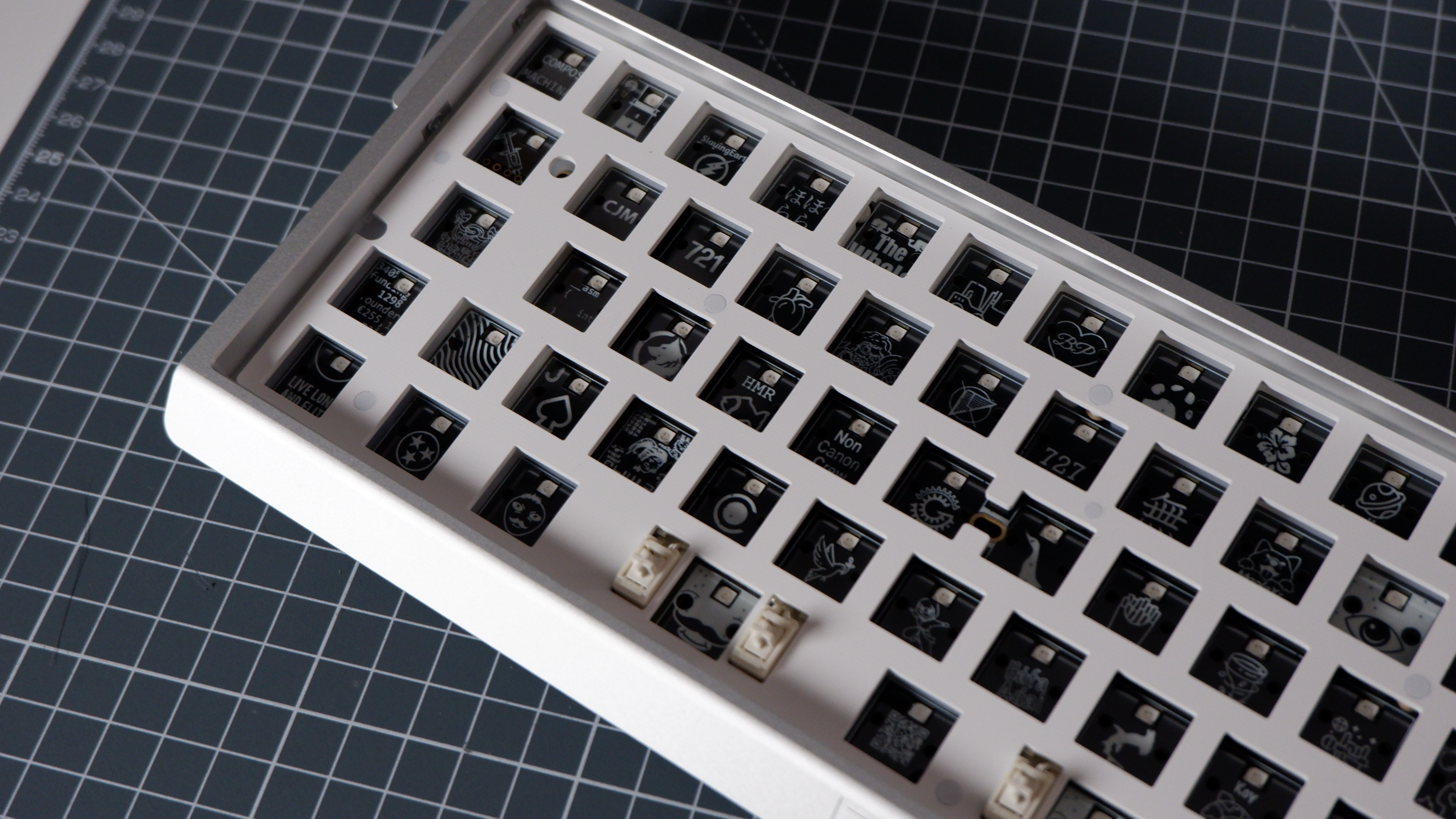 The Wooting 60HE v2 at various stages of being built.