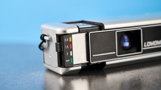 A gray Lomography Lomomatic 110 film camera in the metal variant