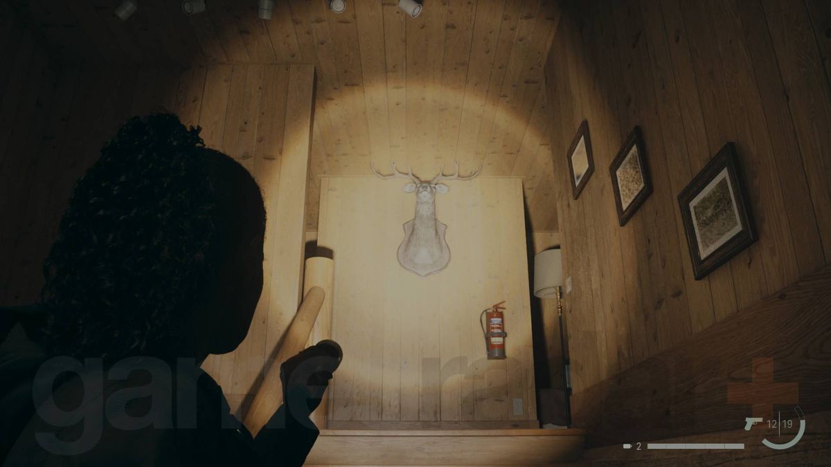 Alan Wake 2 deer head in bright falls woods ranger station