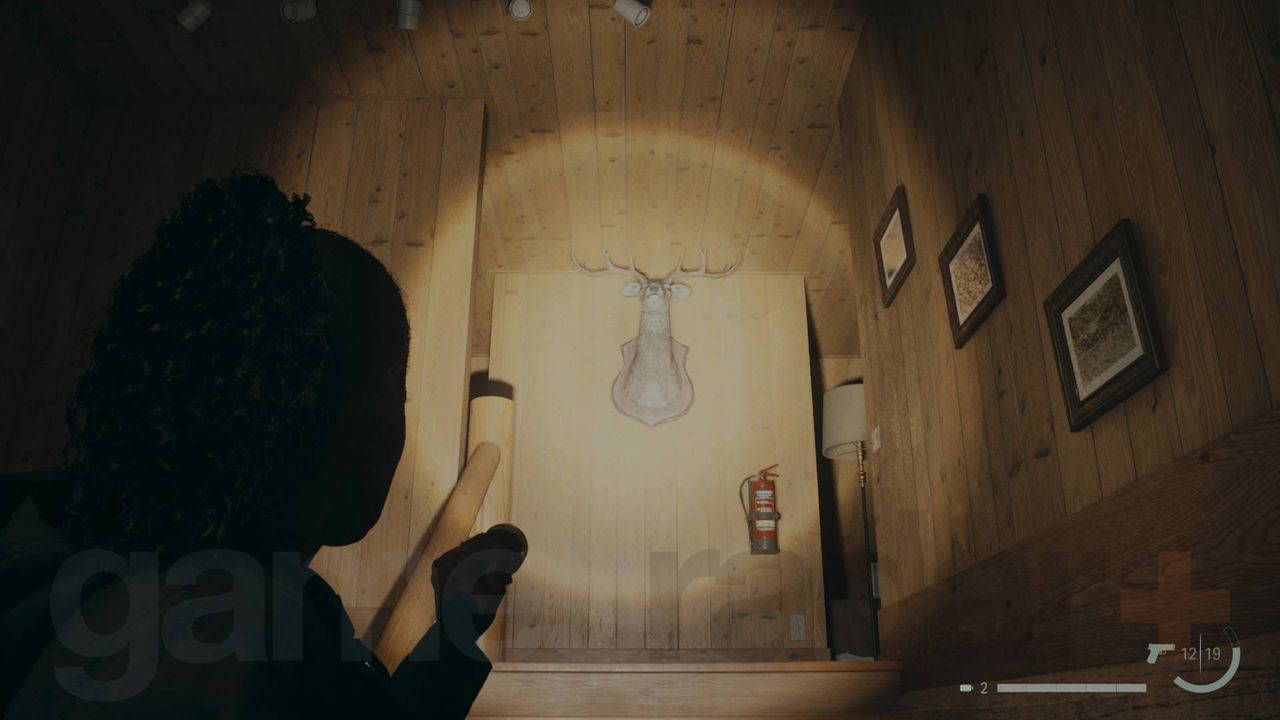 Alan Wake 2 deer head in bright falls woods ranger station