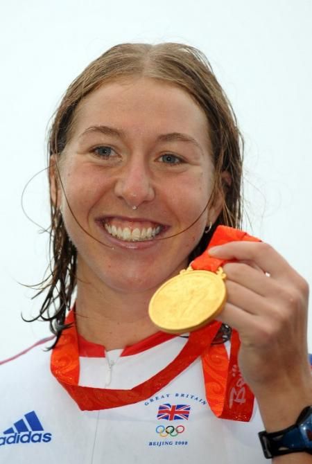 A beaming Nicole Cooke and her Olympic Games gold medal