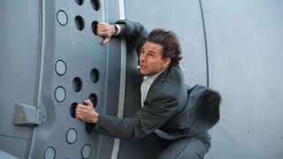 Tom Cruise holds onto side of plane in Mission: Impossible - Rogue Nation