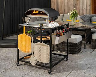 Ooni pizza oven on a custom made stand with pizza oven accessories