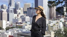 A wealthy woman stands on the streets in San Francisco