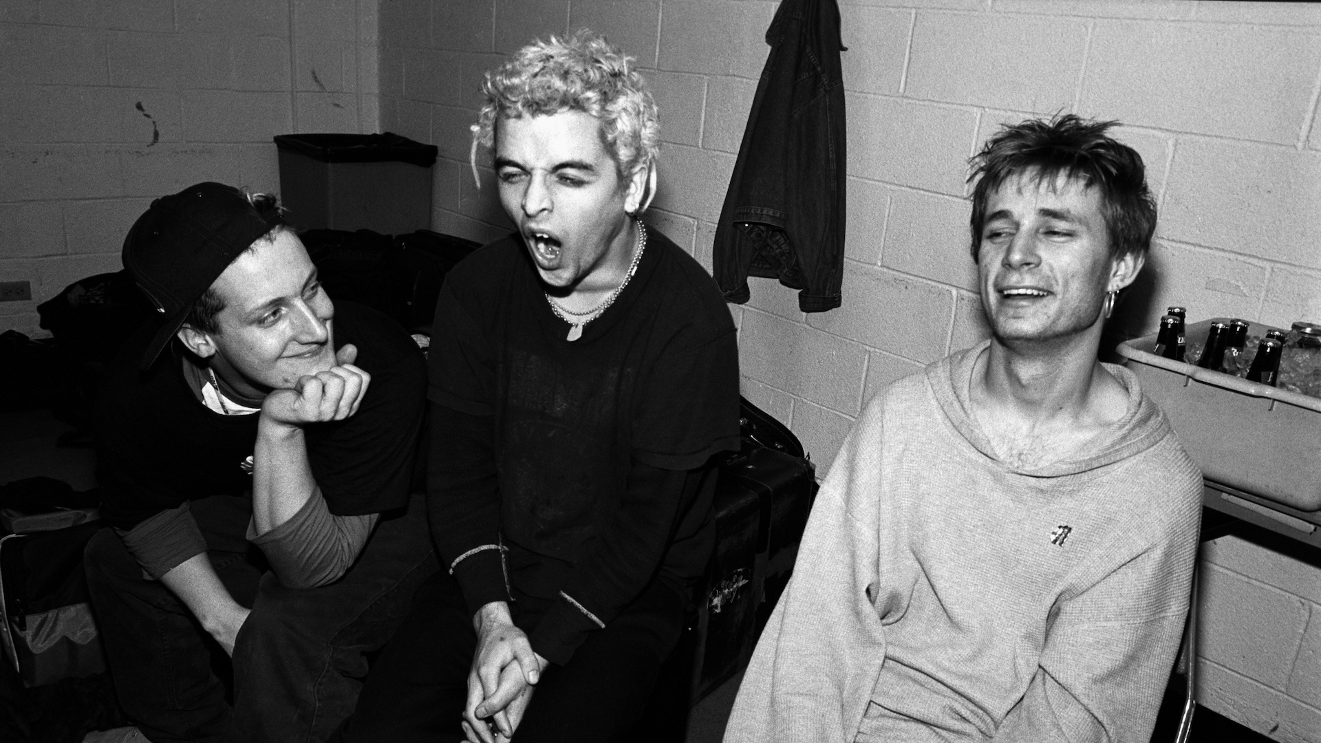 Green Day pose for a portrait backstage at Madison Square Garden in 1994 in New York City. Billie Joe Armstrong is yawning.