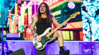 Steve Harris playing on stage