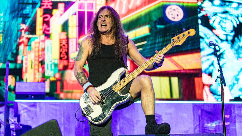 Steve Harris playing on stage