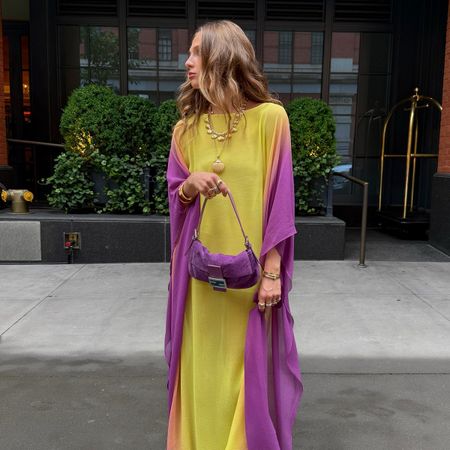 Hannah wears a purple and yellow dress.