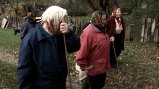 Three elderly women walking in The Babushkas of Chernobyl