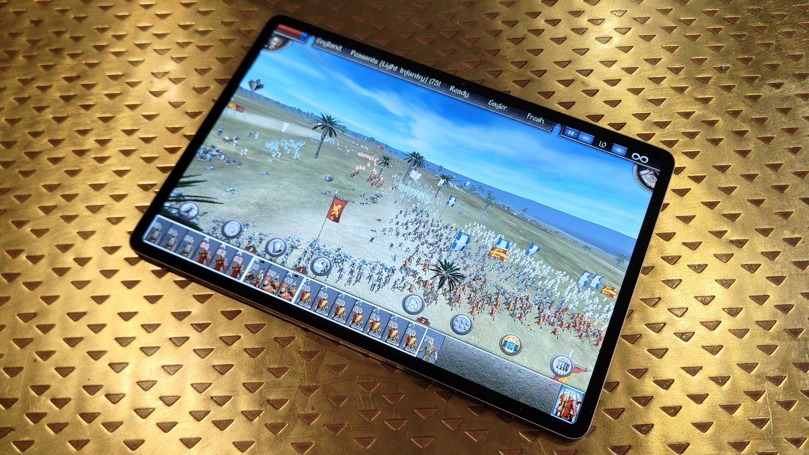 The Honor Pad V9 on a bronze table.