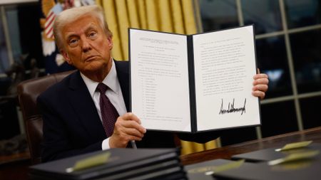 President Donald Trump signs executive orders in the Oval Office