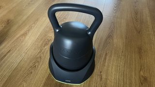 JAXJOX Connect 2.0 kettlebell on wooden floor during testing