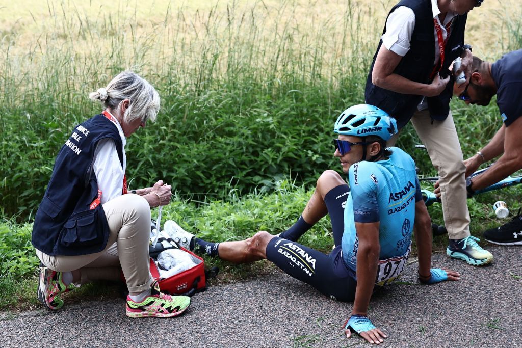 Astana Qazaqstan Teams Kazakh rider Andrey Zeits C receives medical assistance after he crashed in the pack during the third stage of the 75th edition of the Criterium du Dauphine cycling race 1945 kms between MonistrolSurLoire and Le Coteau centraleastern France on June 6 2023 Photo by AnneChristine POUJOULAT AFP Photo by ANNECHRISTINE POUJOULATAFP via Getty Images