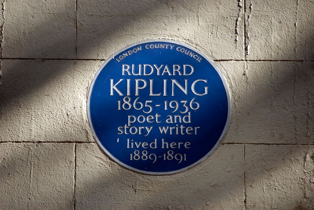 blue plaque marking a home of poet and story writer rudyard kipling, villiers street, london, england