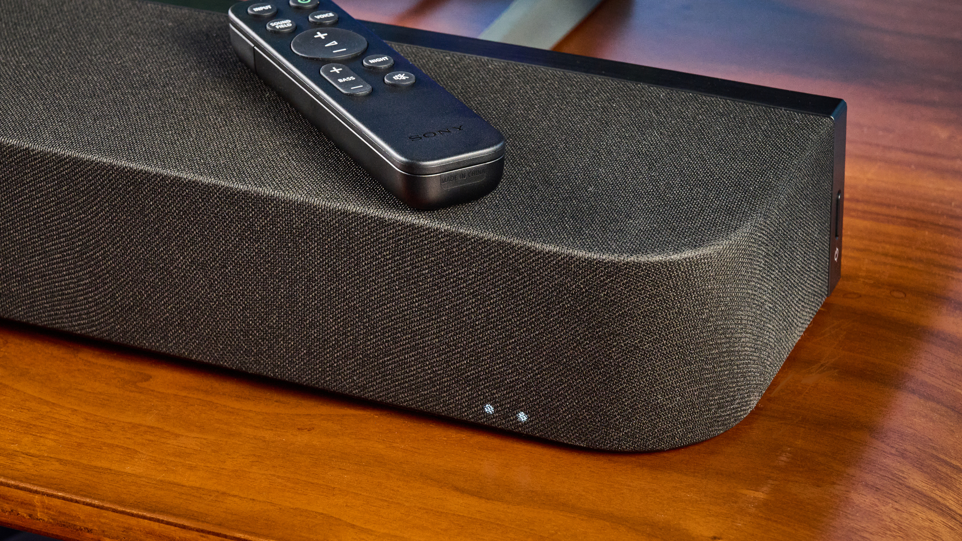 the sony bravia theater bar 7 photographed with the subwoofer with a TV on the tom's guide blue background