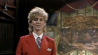 Olivia Newton-John in a red suit on SNL