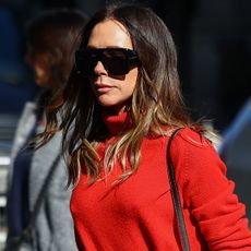 Victoria Beckham arrives at Paris Fashion Week wearing a rare, shearling Herm&egrave;s Kelly bag
