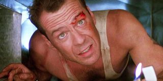 John McClane crawling through an air duct in Die Hard