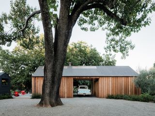 facade of wine country barn with car parked