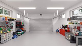 a clean and clear white garage with an organized storage system