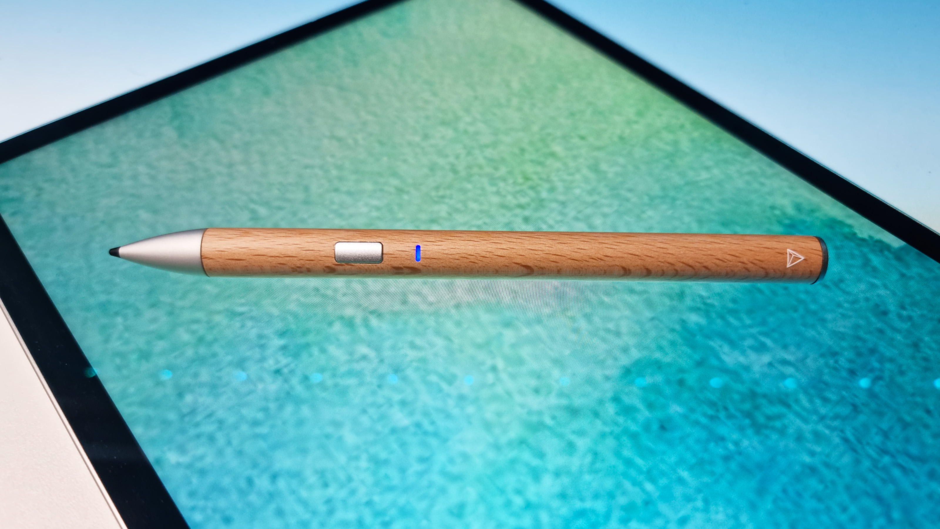 A shot of the Adonit Log Stylus on a colorful background