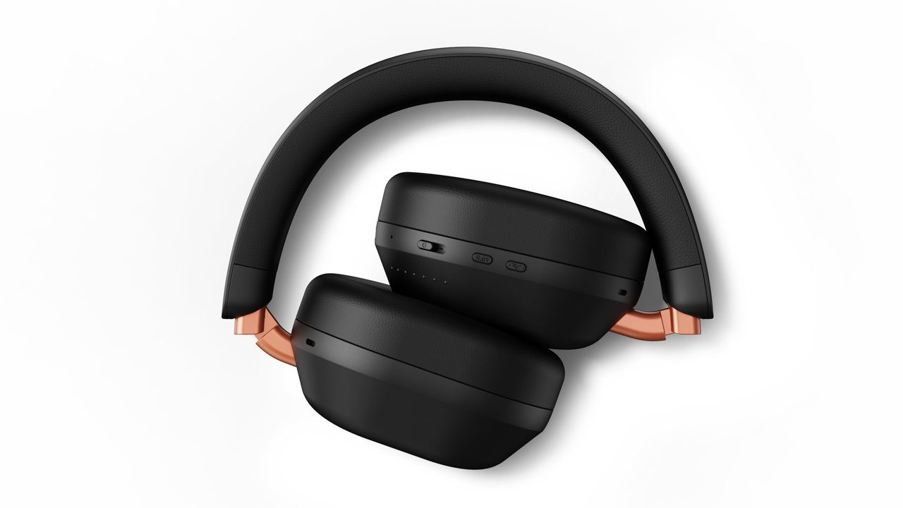 Fidelio L5 headphones on a dark blue background, or folded