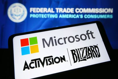  Microsoft and Activision Blizzard logos on a smartphone and Federal Trade Commission (FTC) logo on a pc screen.
