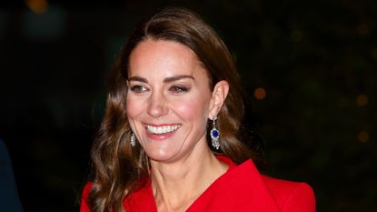 Catherine, Duchess of Cambridge (wearing Queen Elizabeth, The Queen Mother's Sapphire and Diamond Fringe Earrings) attends the 'Together at Christmas' community carol service at Westminster Abbey on December 8, 2021 in London, England. The carol service, hosted and spearheaded by The Duchess of Cambridge, pays tribute to the work of individuals and organisations across the UK who have supported their communities through the COVID-19 pandemic.