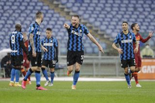 Milan Skriniar celebrates scoring for Inter