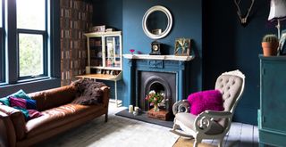 Blue living room with fireplace and beautiful antique furniture